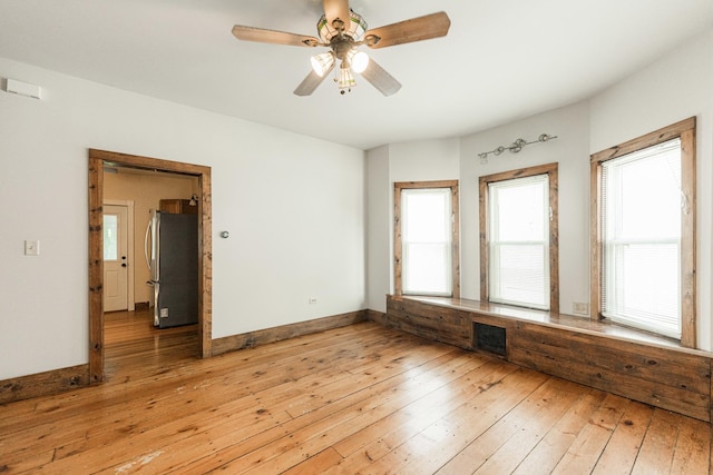 324 N 6th St, Dekalb, IL 60115 - unfurnished room featuring light wood-style floors and a ceiling fan