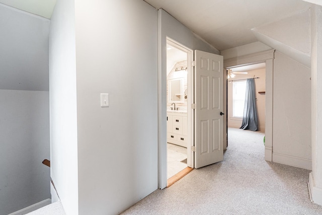 324 N 6th St, Dekalb, IL 60115 - hall with light colored carpet and a sink