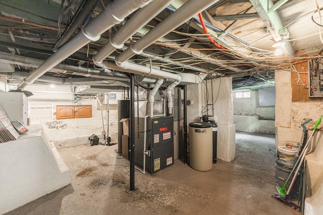 324 N 6th St, Dekalb, IL 60115 - basement featuring a water softener system and heating unit
