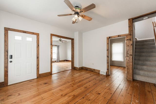324 N 6th St, Dekalb, IL 60115 - foyer entrance with ceiling fan, stairway, and light wood-type flooring