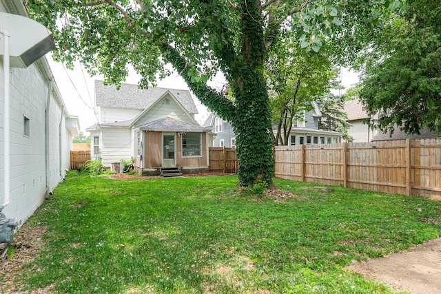 324 N 6th St, Dekalb, IL 60115 - back of property featuring entry steps and a fenced backyard