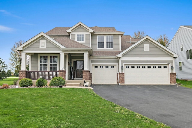 244 Prescott Ave, Elgin, IL 60124 - view of front of home with driveway, brick siding, a shingled roof, a porch, and a front lawn
