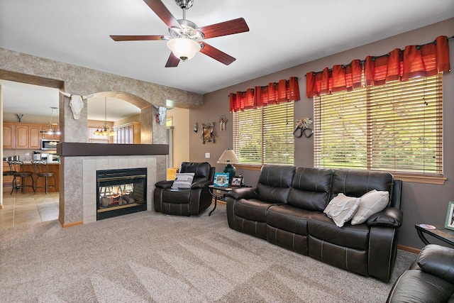 244 Prescott Ave, Elgin, IL 60124 - living area featuring light colored carpet, ceiling fan, and a fireplace