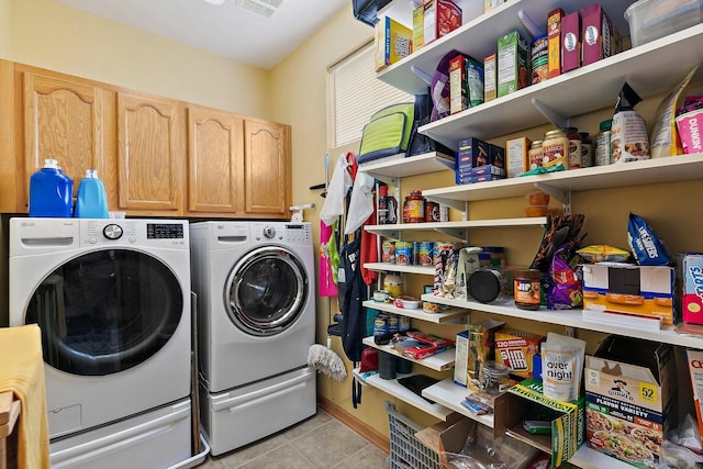 244 Prescott Ave, Elgin, IL 60124 - laundry room featuring independent washer and dryer, light tile patterned floors, and cabinet space