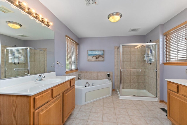 244 Prescott Ave, Elgin, IL 60124 - bathroom with vanity, a stall shower, a bath, and tile patterned flooring