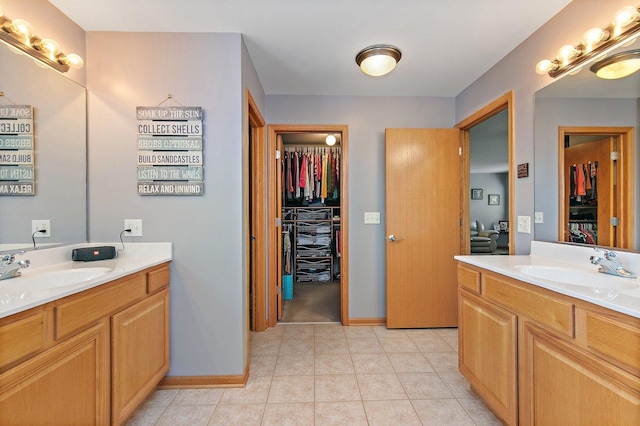 244 Prescott Ave, Elgin, IL 60124 - full bath with two vanities, a spacious closet, and tile patterned flooring