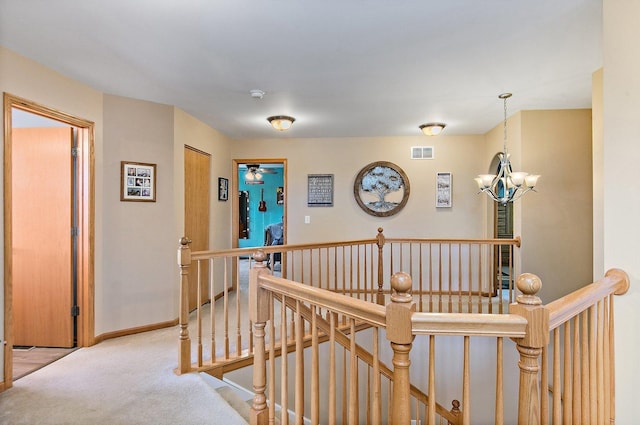 244 Prescott Ave, Elgin, IL 60124 - corridor with an upstairs landing, a chandelier, and carpet