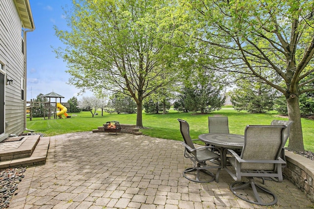 244 Prescott Ave, Elgin, IL 60124 - view of patio featuring a playground and outdoor dining area