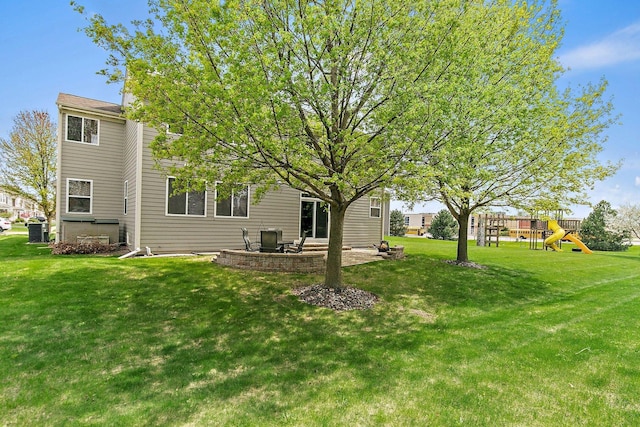 244 Prescott Ave, Elgin, IL 60124 - back of property featuring a patio, a playground, and a yard