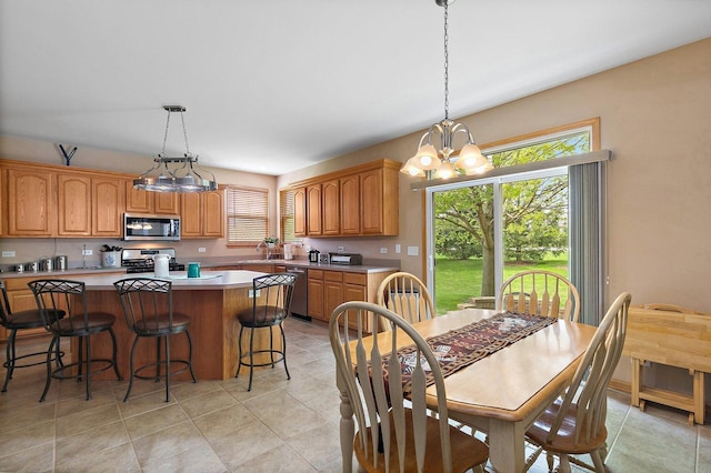 244 Prescott Ave, Elgin, IL 60124 - dining space featuring a chandelier and light tile patterned floors