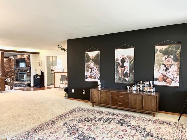 1413 Eustace Dr, Dixon, IL 61021 - living area featuring a large fireplace and baseboards