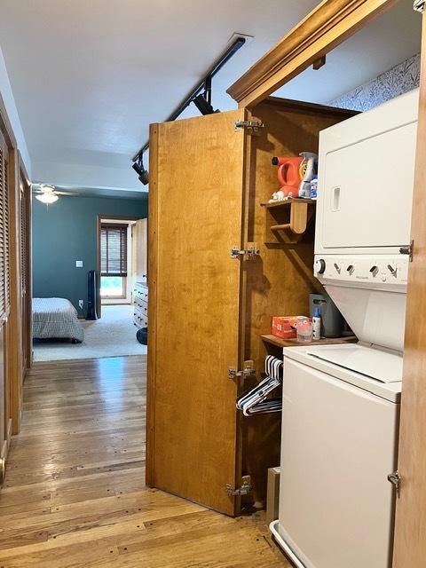 1413 Eustace Dr, Dixon, IL 61021 - washroom featuring stacked washer and clothes dryer and light wood-type flooring