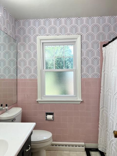1413 Eustace Dr, Dixon, IL 61021 - bathroom featuring a baseboard radiator, tile walls, vanity, a shower with curtain, and tile patterned floors