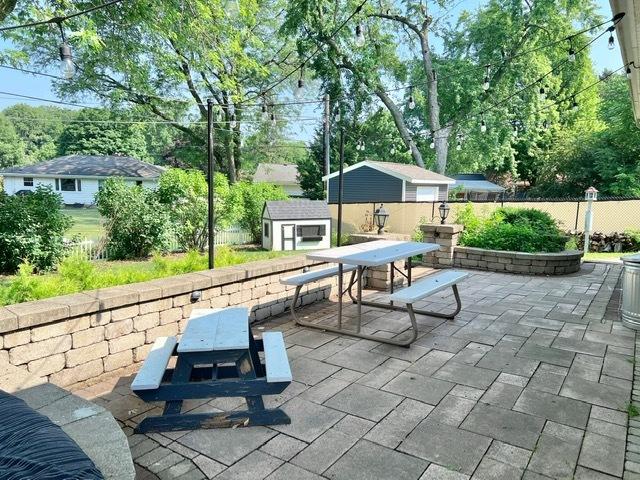 1413 Eustace Dr, Dixon, IL 61021 - view of patio / terrace featuring outdoor dining area and a storage unit