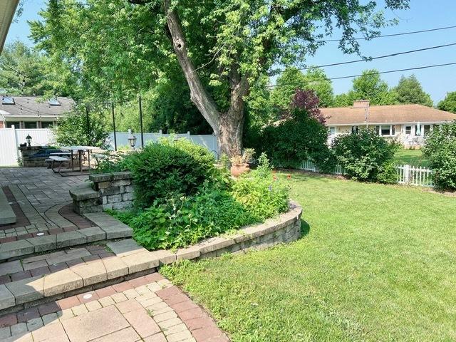 1413 Eustace Dr, Dixon, IL 61021 - fenced backyard featuring a patio area
