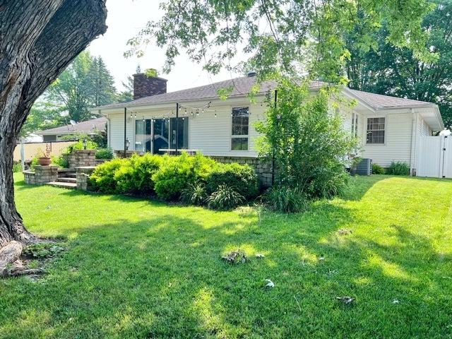 1413 Eustace Dr, Dixon, IL 61021 - rear view of property featuring a chimney