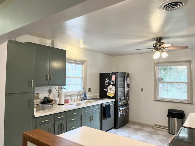 1413 Eustace Dr, Dixon, IL 61021 - kitchen with stainless steel appliances, light floors, a ceiling fan, and light countertops