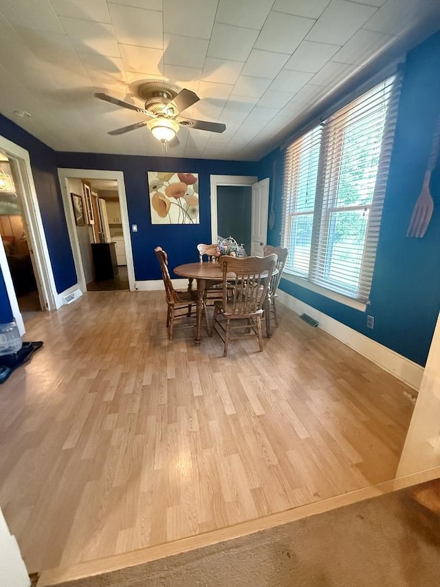 106 E Poplar St, Normal, IL 61761 - dining space with a ceiling fan and wood finished floors