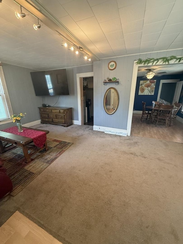 106 E Poplar St, Normal, IL 61761 - carpeted living area with rail lighting and baseboards