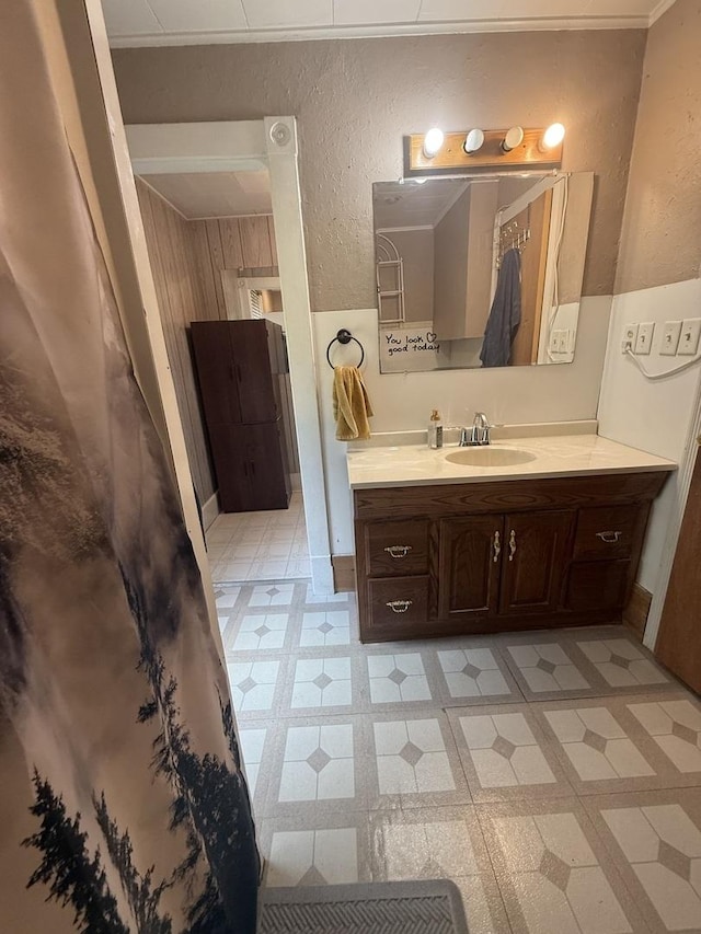 106 E Poplar St, Normal, IL 61761 - bathroom featuring a textured wall, vanity, and tile patterned floors