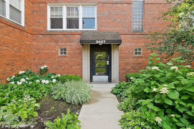 2427 W Farragut Ave Unit 1A, Chicago, IL 60625 - view of exterior entry with brick siding
