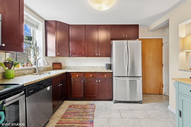 2427 W Farragut Ave Unit 1A, Chicago, IL 60625 - kitchen featuring stainless steel appliances, reddish brown cabinets, light tile patterned flooring, and light stone counters