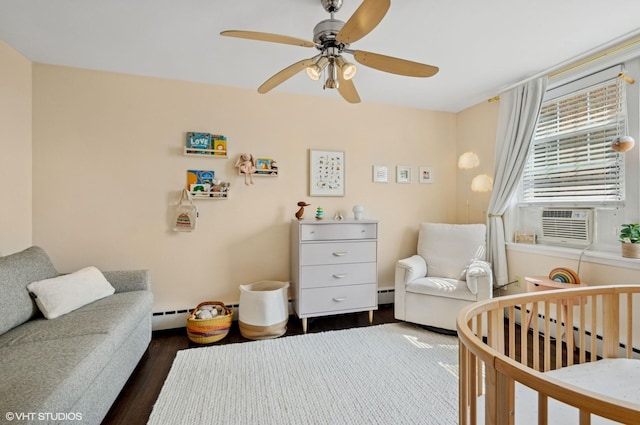 2427 W Farragut Ave Unit 1A, Chicago, IL 60625 - bedroom featuring dark wood-style flooring, ceiling fan, cooling unit, a nursery area, and baseboard heating