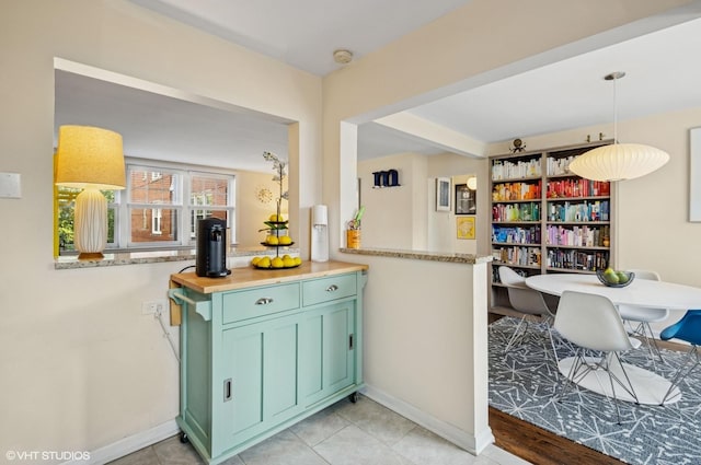 2427 W Farragut Ave Unit 1A, Chicago, IL 60625 - kitchen featuring green cabinetry and hanging light fixtures