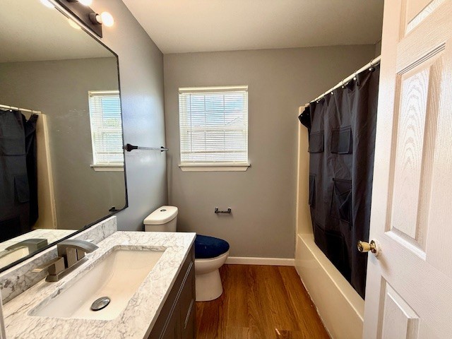 5302 Foxwood Ct, Plainfield, IL 60586 - full bath featuring vanity, wood finished floors, and shower / tub combo with curtain