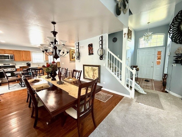 5302 Foxwood Ct, Plainfield, IL 60586 - dining space featuring a chandelier, stairway, and wood finished floors