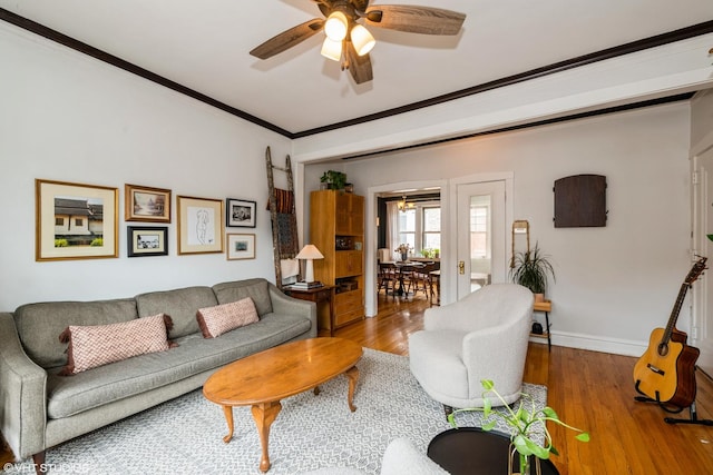 242 S Maple Ave Unit 3W, Oak Park, IL 60302 - living room featuring a ceiling fan, wood finished floors, and ornamental molding