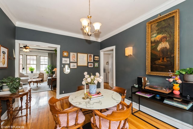 242 S Maple Ave Unit 3W, Oak Park, IL 60302 - dining area with a chandelier, hardwood / wood-style flooring, ornamental molding, and ceiling fan