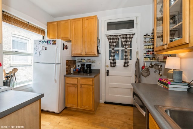 242 S Maple Ave Unit 3W, Oak Park, IL 60302 - kitchen with freestanding refrigerator, light wood-style floors, stainless steel dishwasher, and dark countertops