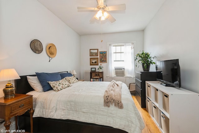 242 S Maple Ave Unit 3W, Oak Park, IL 60302 - bedroom with radiator heating unit, light wood-type flooring, cooling unit, and ceiling fan
