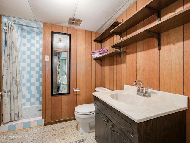 628 W 15th St, Chicago Heights, IL 60411 - bathroom with a stall shower, vanity, and wood walls
