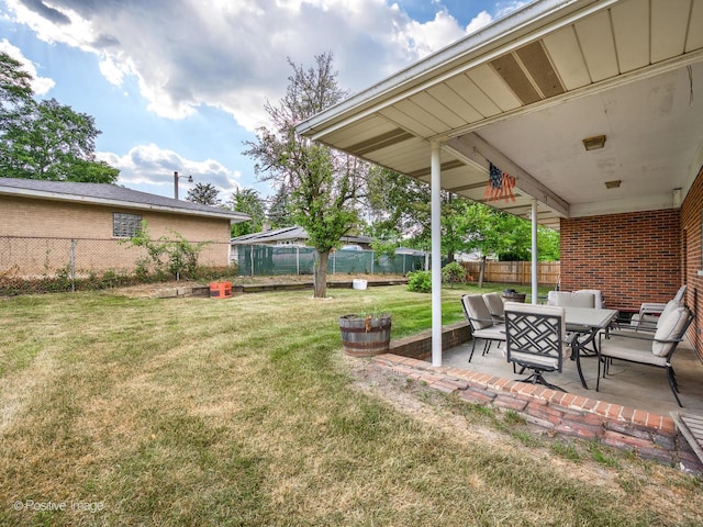 628 W 15th St, Chicago Heights, IL 60411 - fenced backyard with a patio area and outdoor dining space