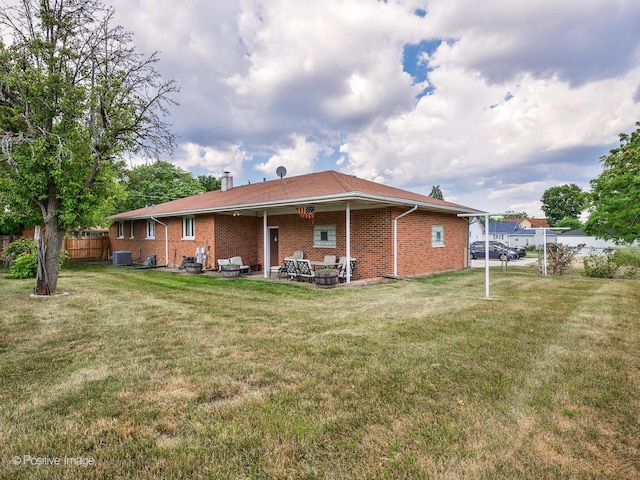 628 W 15th St, Chicago Heights, IL 60411 - rear view of property with brick siding and a patio area