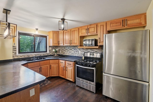 924 E 159th Pl, South Holland, IL 60473 - kitchen with stainless steel appliances, dark countertops, backsplash, decorative light fixtures, and dark wood-style floors