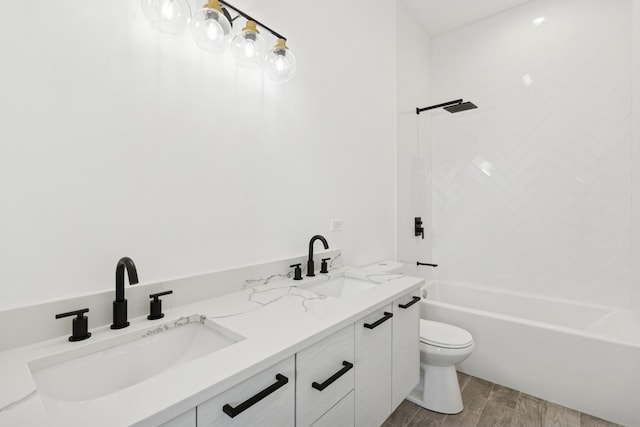 1537 Scoville Ave, Berwyn, IL 60402 - full bathroom featuring wood finished floors, double vanity, and shower / washtub combination