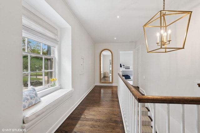 2735 Simpson St, Evanston, IL 60201 - corridor with a chandelier and dark wood finished floors