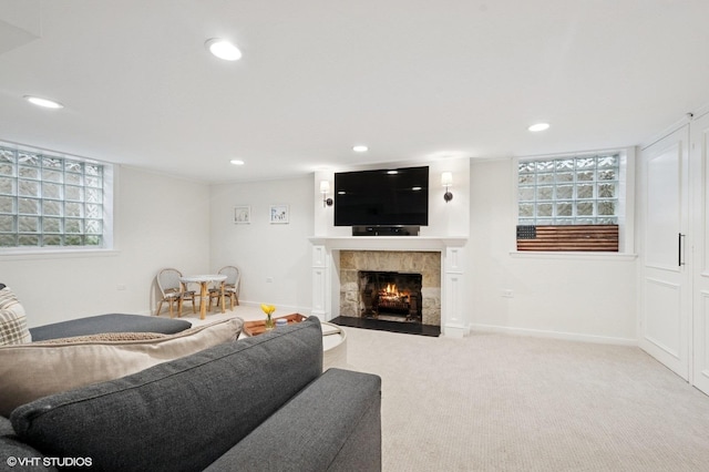 2735 Simpson St, Evanston, IL 60201 - living area featuring recessed lighting, a tiled fireplace, plenty of natural light, and carpet floors