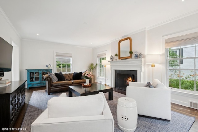 2735 Simpson St, Evanston, IL 60201 - living area with wood finished floors, a warm lit fireplace, and crown molding