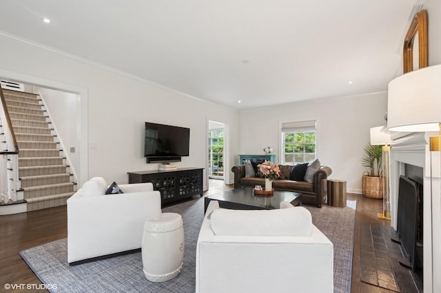 2735 Simpson St, Evanston, IL 60201 - living area featuring dark wood finished floors, a fireplace, crown molding, stairs, and recessed lighting