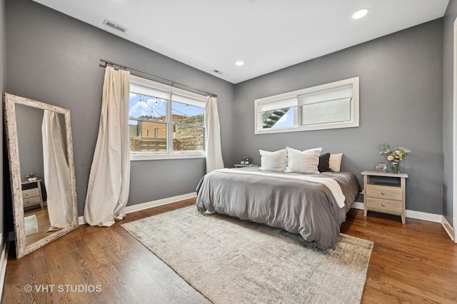 2125 N Mozart St Unit 3, Chicago, IL 60647 - bedroom with multiple windows, wood finished floors, and recessed lighting