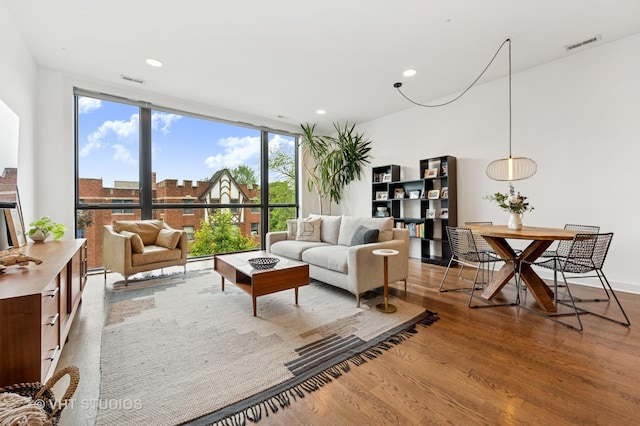 2125 N Mozart St Unit 3, Chicago, IL 60647 - living area featuring wood finished floors, plenty of natural light, expansive windows, and recessed lighting