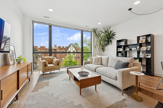 2125 N Mozart St Unit 3, Chicago, IL 60647 - living room with floor to ceiling windows, wood finished floors, and recessed lighting