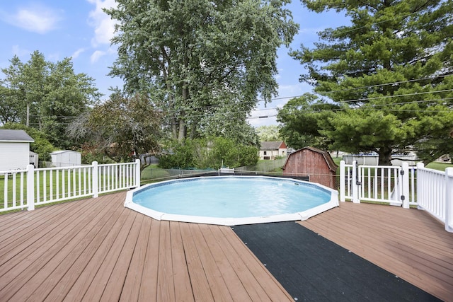 2N477 Bernice Ave, Glen Ellyn, IL 60137 - view of swimming pool with a storage unit, a wooden deck, and a barn
