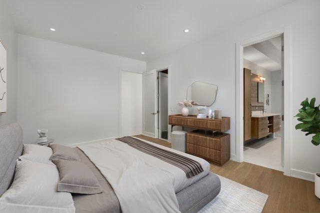 2413 W Fullerton Ave Unit 3, Chicago, IL 60647 - bedroom with light wood-style flooring, recessed lighting, and ensuite bathroom