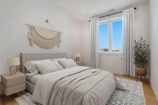 2413 W Fullerton Ave Unit 3, Chicago, IL 60647 - bedroom featuring baseboards and light wood-style floors