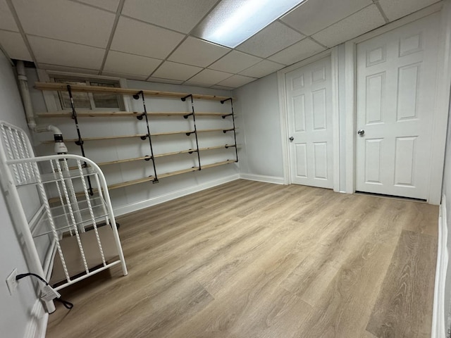 8852 Robin Dr Unit E, Des Plaines, IL 60016 - finished basement featuring wood finished floors and a paneled ceiling
